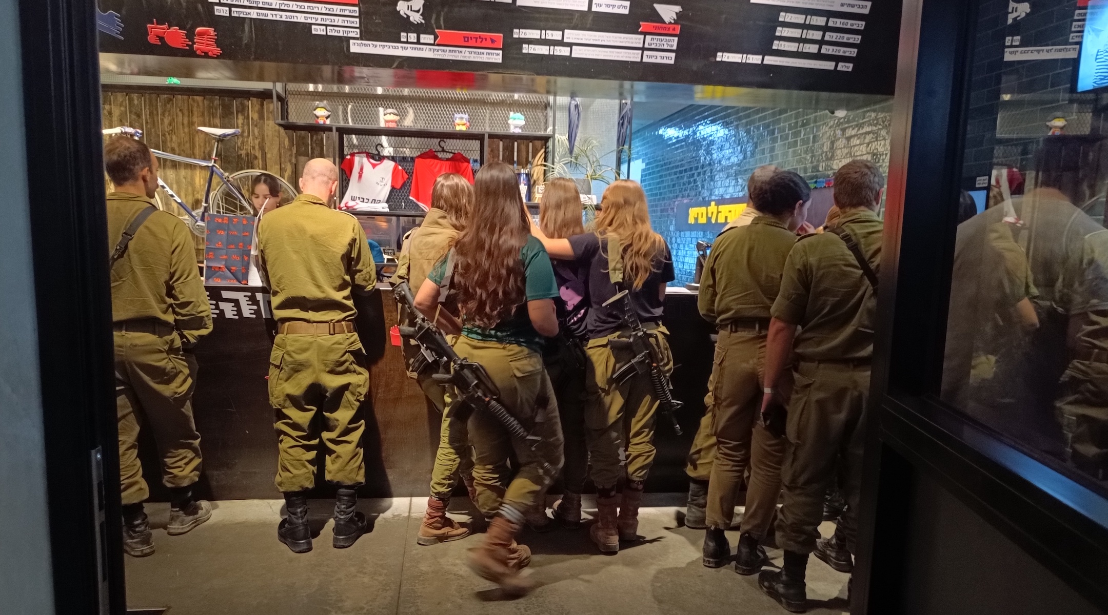 Soldiers stand in line in November 2023 at a rest stop in Israel's north that offers discounted fare to troops. (Eliyahu Freedman)
