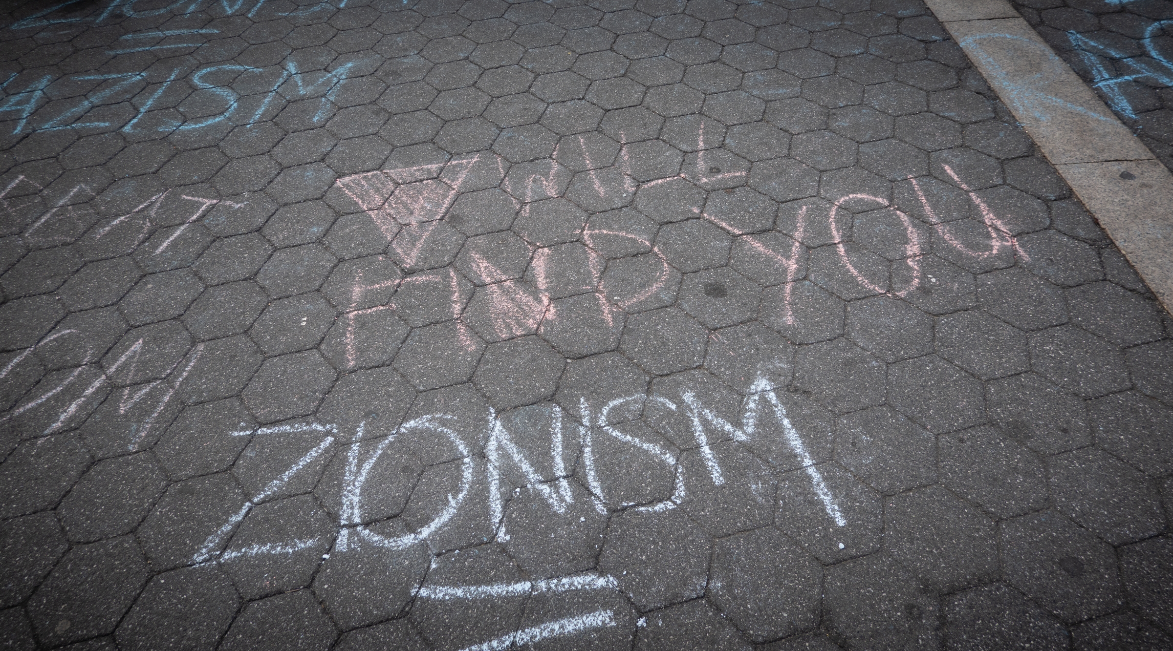 Chalk graffiti, including an inverted triangle, a Hamas symbol, in Union Square, June 10, 2024. (Luke Tress)