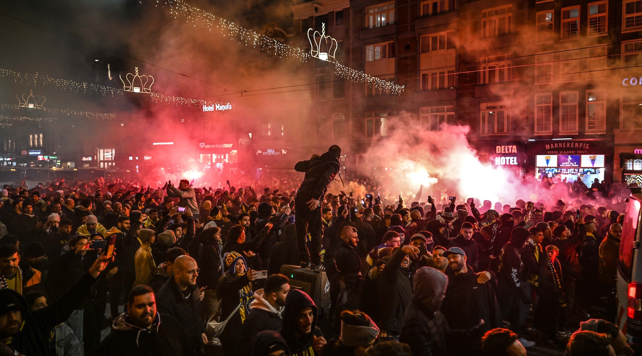 Fans of Maccabi Tel Aviv stage a pro-Israel demonstration at the Dam Square on Nov. 7, lighting up flares and chanting slogans ahead of the  match between Maccabi Tel Aviv and Ajax. (Mouneb Taim/Anadolu via Getty Images)