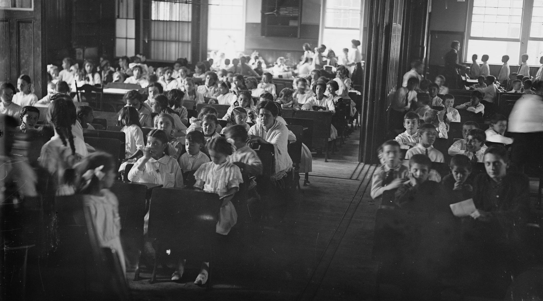 children in an old-timey schoolroom