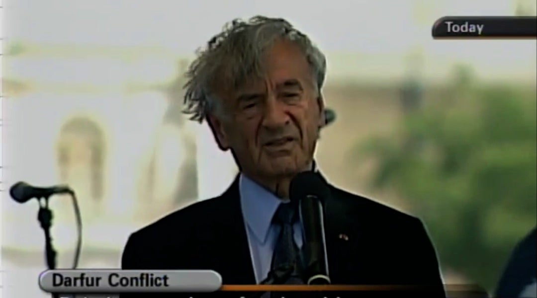Elie Wiesel behind a podium